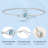 "Infinite Embrace" Bracelet en argent sterling avec aquamarine, symbole de l'infini, pierre de naissance de mars