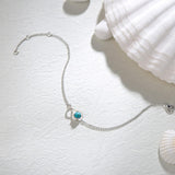 "Infinite Embrace" Bracelet en argent sterling avec turquoise bleue, symbole de l'infini, pierre de naissance de décembre
