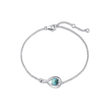 "Infinite Embrace" Bracelet en argent sterling avec turquoise bleue, symbole de l'infini, pierre de naissance de décembre