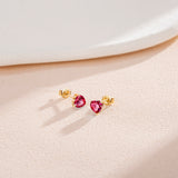 Boucles d'oreilles en forme de cœur en or jaune 14k avec pierres précieuses