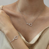 FANCIME Collier en or massif 14K en forme de cœur entrelacé infini