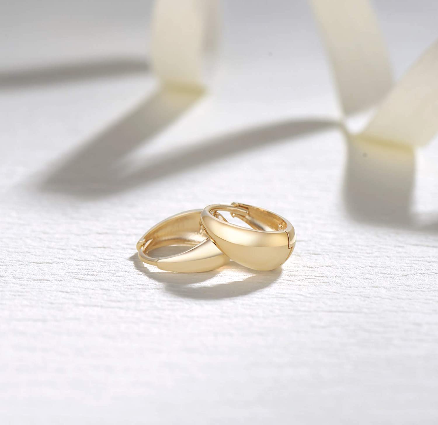 Small yellow gold hoops made in 14k yellow gold